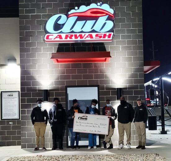 Employees and representatives from the Boys and Girls Club of Greater St. Louis presenting check in front of Club Car Wash